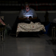 A man watches his cellphone while waiting at Humacao Arena refugee center for the imminent impact of Maria, a Category 5 hurricane. (Carlos Giusti/AP Images)